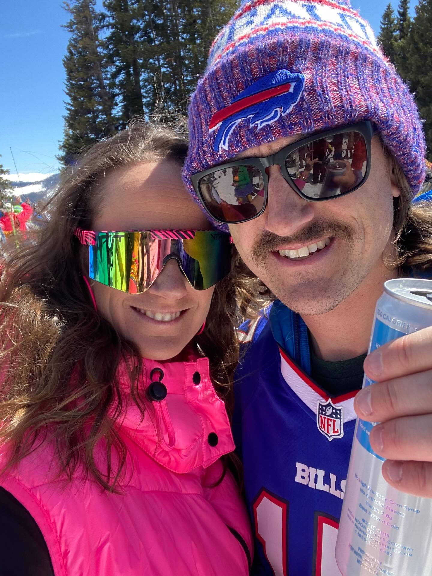 Ashley and Cody celebrating outdoors